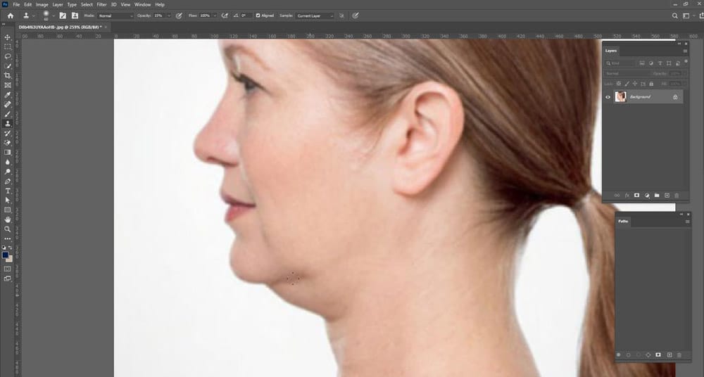 Start brushing over the double chin area. Before that, hold down the Alt button from your keyboard and choose the area you w